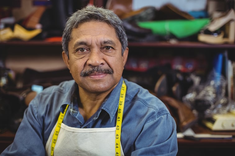 portrait-shoemaker-standing-workshop (1)